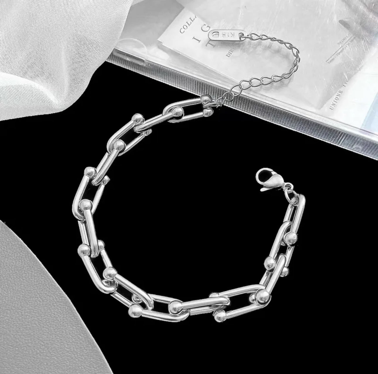 Close up view of elegant 18k Silver plated stainless steel, designer inspired, Tiffany link chain bracelet dupe with a smooth, polished finish, designed with a lightweight and tarnish resistant material for timeless sophistication.