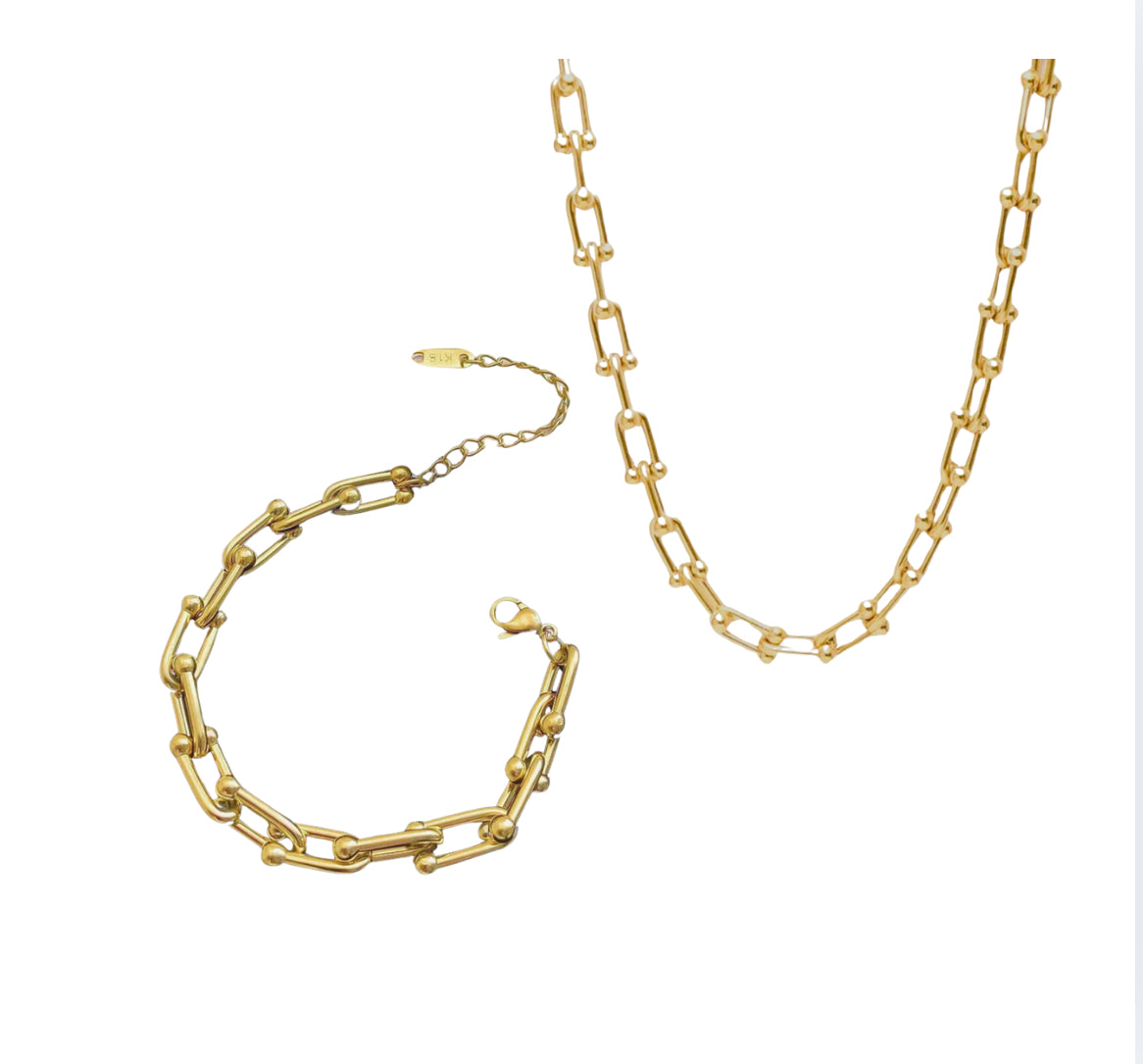 Close up view of elegant 18k Gold plated stainless steel designer inspired, Tiffany link chain necklace and bracelet matching set dupe with a smooth, polished finish, designed with a lightweight and tarnish resistant material for timeless sophistication.