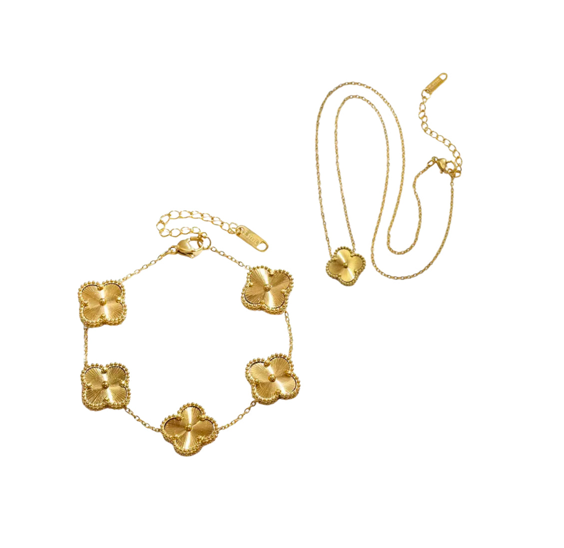Close up front view of elegant 18K gold plated designer-inspired Van Cleef clover link chain bracelet and necklace set. Lightweight and versatile design, with long lasting, waterproof plating perfect for any occasion, from casual outings to formal event out on the town.