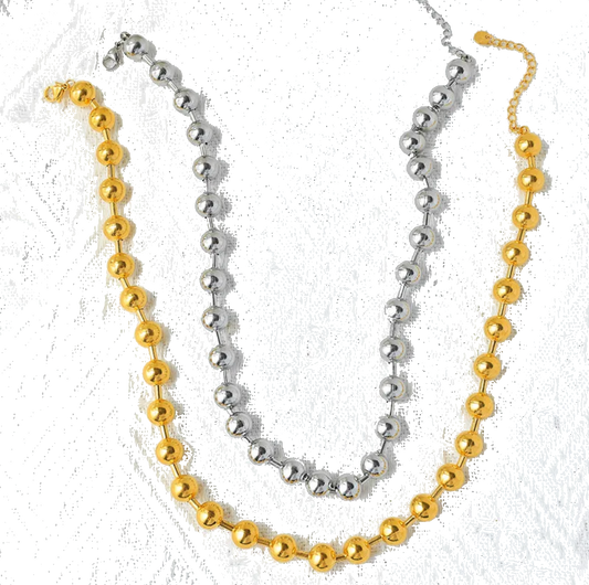 Close up view of elegant 18k Gold and Silver plated stainless steel, designer inspired,  Tiffany ball chain necklace dupe with a smooth, polished finish, designed with a lightweight and tarnish resistant material for timeless sophistication.