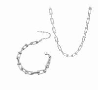 Close up view of elegant 18k Silver plated stainless steel designer inspired, Tiffany link chain necklace and bracelet matching set dupe with a smooth, polished finish, designed with a lightweight and tarnish resistant material for timeless sophistication.