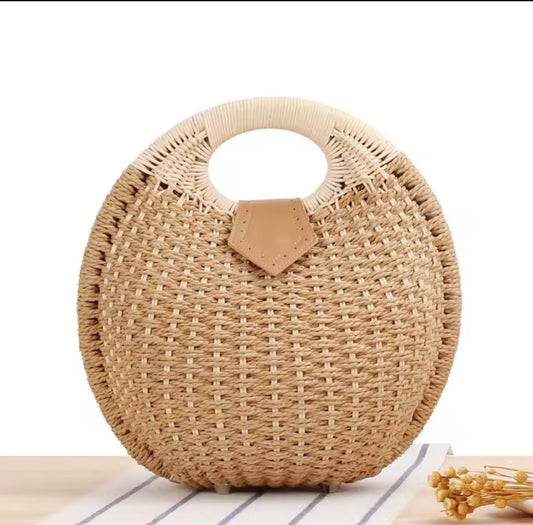 The straw bucket bag close up front view